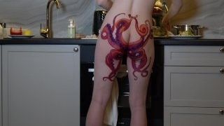 Nude housewife with octopus tat on booty cooks dinner