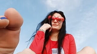 Sole worship on the beach by the river. Mistress Nika smokes and entices you with her soles and toes