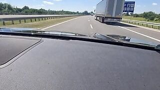 Gorgeous platinum-blonde jerks while driving a truck