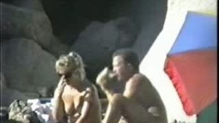 One horny mature couple having sexy time on the beach - spy vid