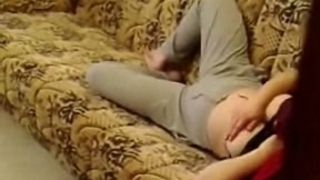 Busty wife in yoga pants masturbating on the couch